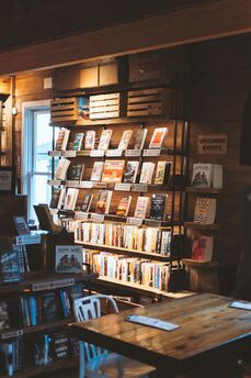A bookshelf in a bookstore, presenting choices to customers.